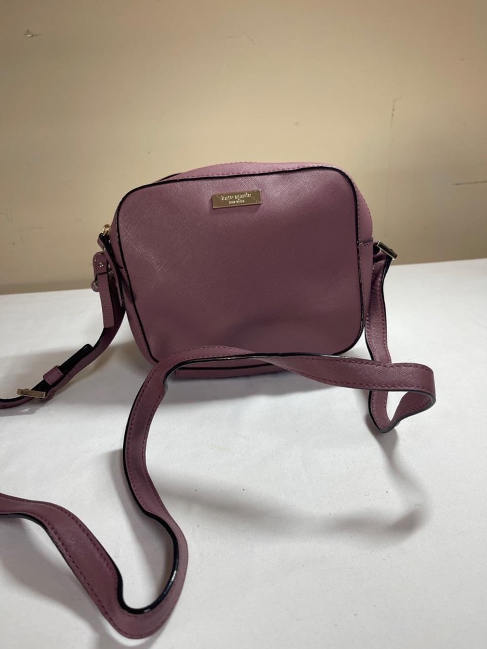 kate spade mauve crossbody bag with gold plaque